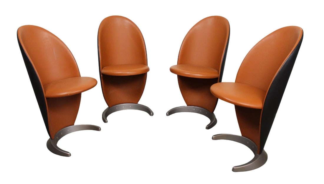 'Petalo Chair' by Reflex: Set of four (six available) mid-century style chairs by Reflex. The Petalo chairs are designed with curved backs and accentuating crescent metal base. The soft leather in orange and black with satin t