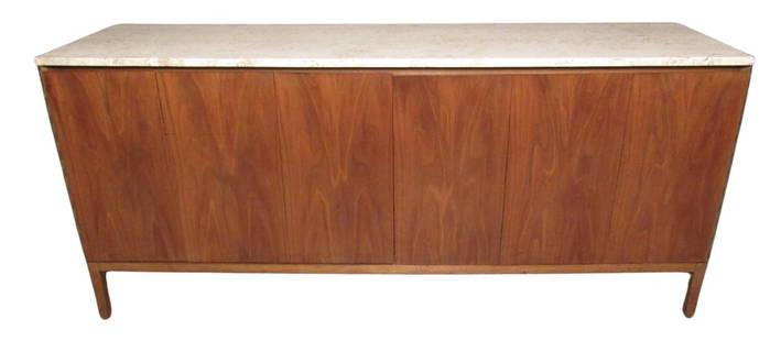 Paul McCobb for Calvin Furniture Eight Drawer Marble Top Dresser: Early Paul McCobb designed "Irwin" Collection dresser made by Calvin Furniture of Grand Rapids, MI. Robust walnut construction conceals eight large pull-out drawers behind a pair of folding doors, whi