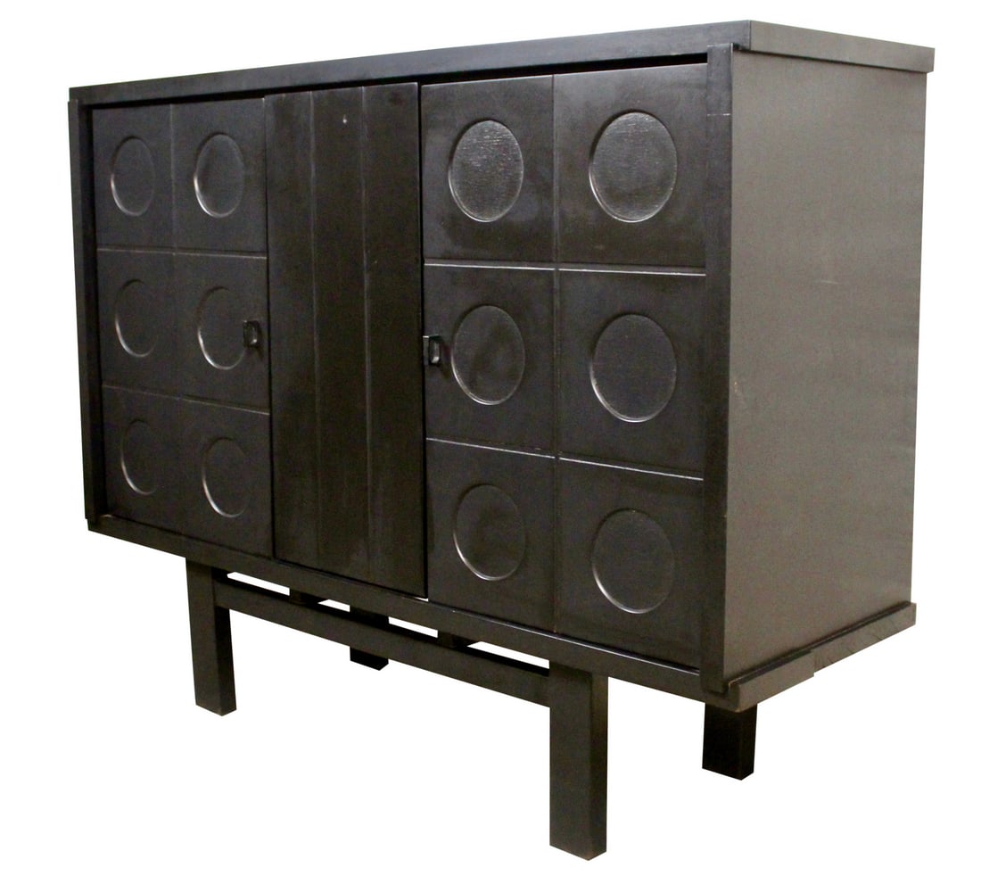 Ebonized Brutalist Cabinet by De Coene Frères of Belgium: Monumental brutalist bar cabinet from the master craftsman of Belgium’s world-renowned De Coene Frères. With a behemoth ebonized three-door cabinet perched upon a robust solid wood frame, it opens