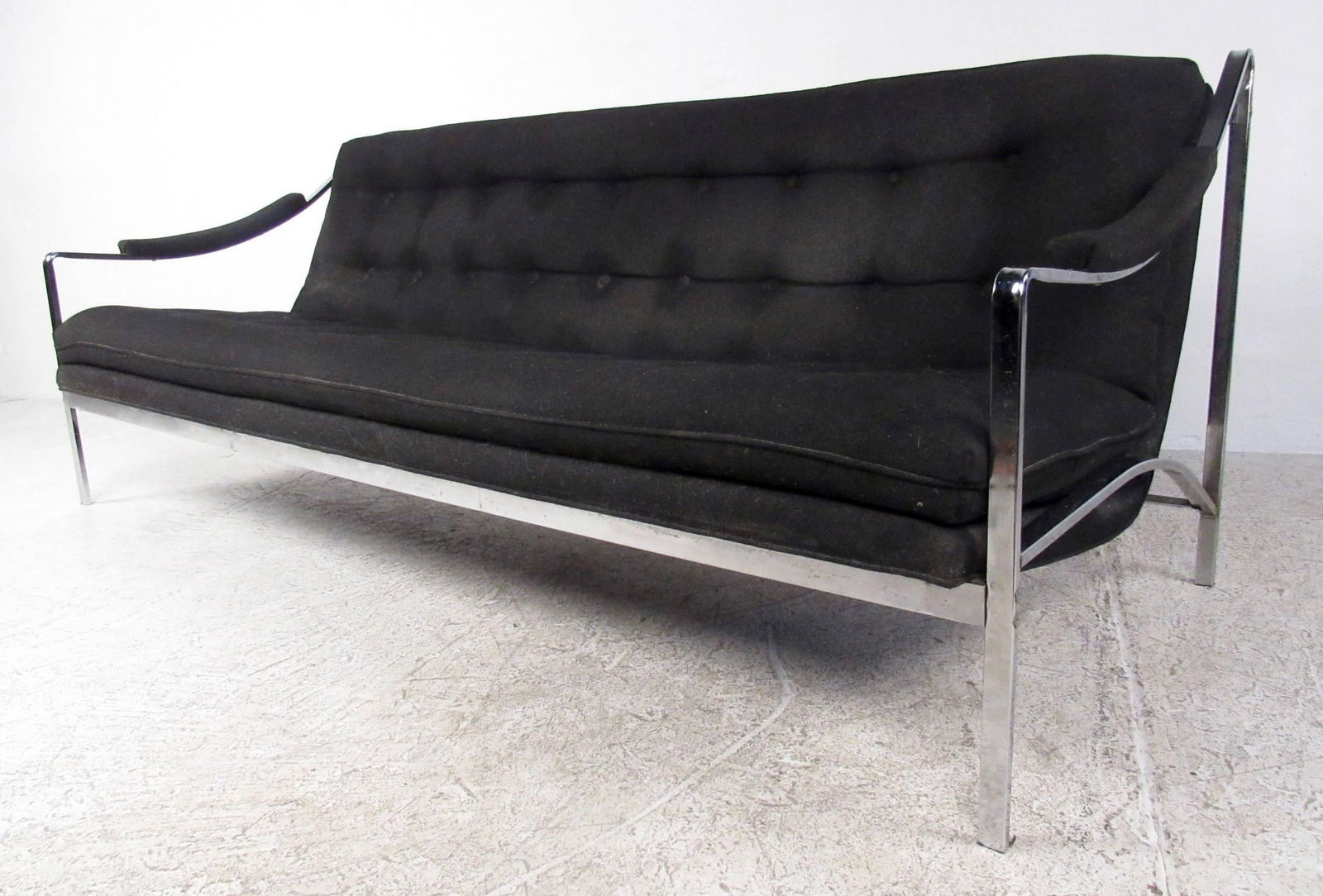 Mid-Century Tufted Chrome Sofa: Polished chrome frame with scoop arms. Fabric upholstery is tufted throughout the back and seat. // PICK UP LOCATION: WALL NJ // Dimensions: Height: 30 in Width: 78.5 in Depth: 32 in Seat