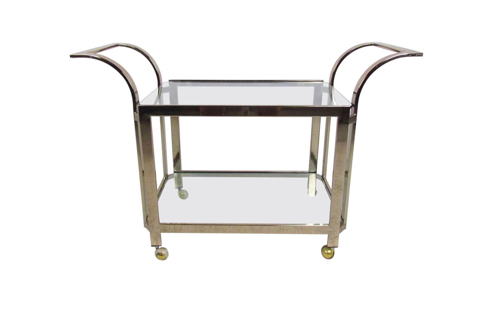 Stylish Mid Century Modern Brass Serving Cart: This vintage modern serving cart features two-tiered glass shelves for bottle or glassware storage. An ideal shop display or bar service cart, the shapely modern design and vintage brass finish add to