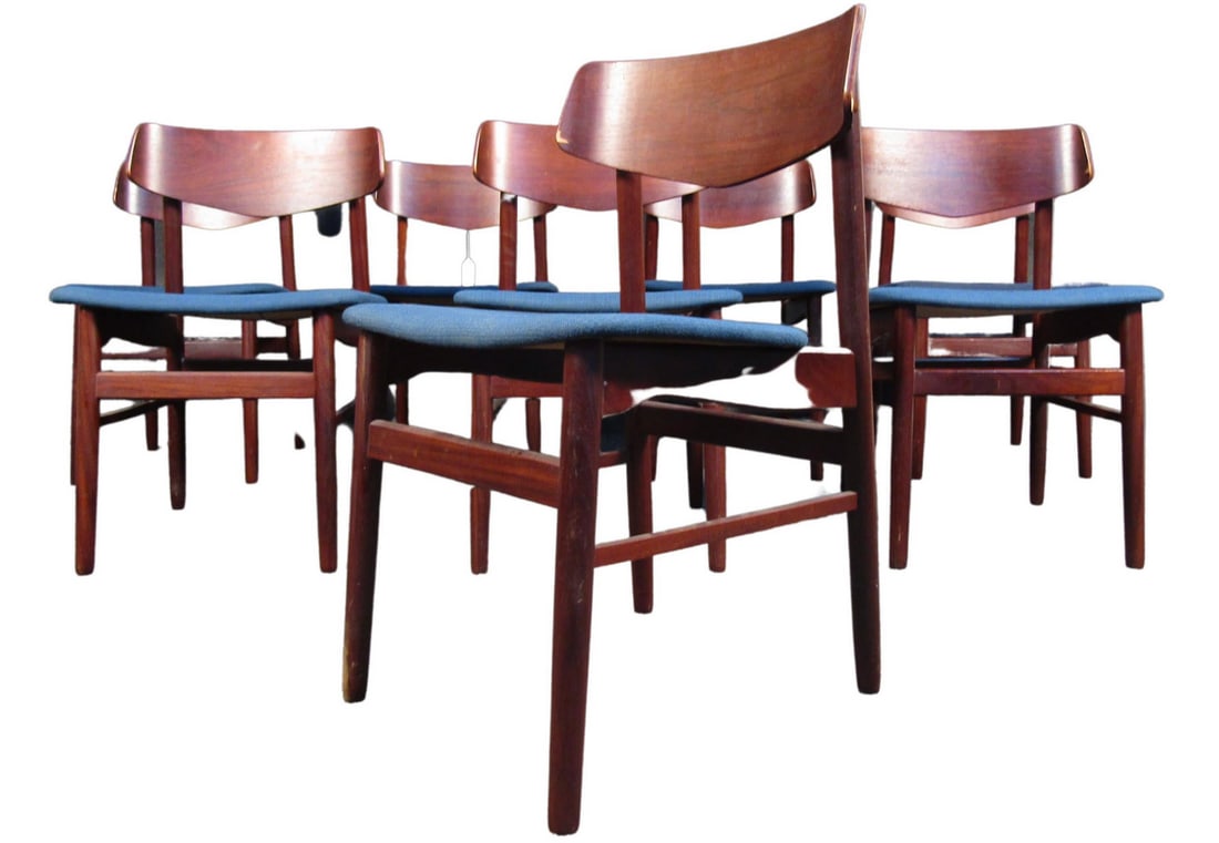 Set of 8 Teak Danish Dining Chairs: Stylish set of 8 Danish modern style dining chairs. These chairs feature contoured backrests with tapered legs and blue upholstered seats. These chairs would make a great addition to any modern