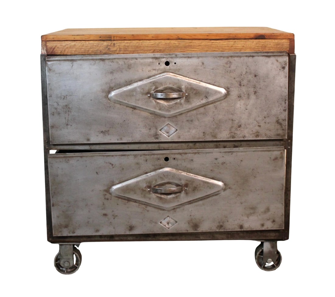 Vintage Industrial Cart with Wood Top: A rugged industrial cart featuring a sturdy metal frame with two oversized drawers and a rich, patinated wood top. Mounted on heavy-duty casters for mobility, this utilitarian piece offers both storag