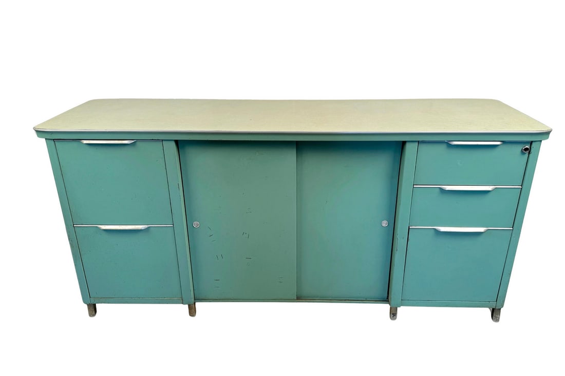 Teal Blue Steel Tanker Office Cabinet: Originally designed for durability and efficiency, this iconic piece is a perfect blend of vintage appeal and modern utility. Whether you're looking to organize your office, display documents, or