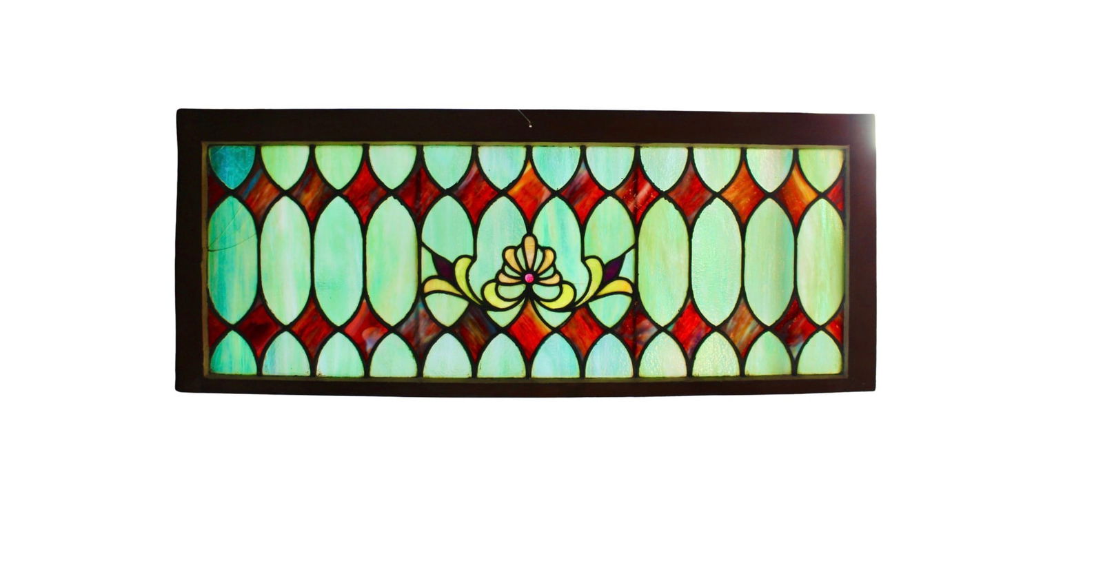 Spectacular Antique Transom Window: This four foot long window features vibrant stained glass patterns for above your doorway. Rich purple diamonds between teal blue marbled pains. The center holds a fleur-de-lis with pink jewel.