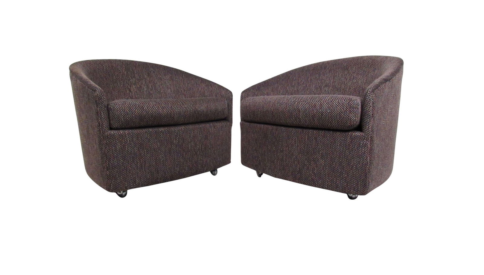 Pair of Stylish Mid-Century Modern Barrel Back Lounge Chairs after Milo Baughman: This unique pair of vintage lounge chairs features sculpted crescent shaped backs, stylish vintage fabric and comfortable design. Rolling casters make these an excellent option for occasional seating