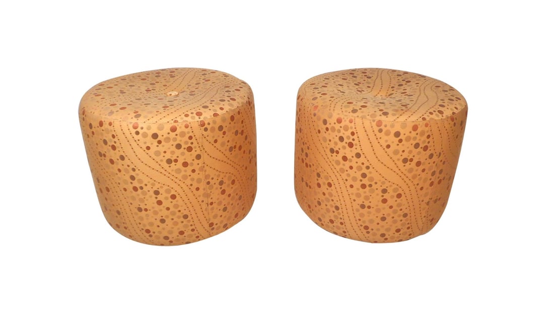 Pair of Vintage Modern Rolling Ottomans: Stylish pair of vintage modern ottomans/footstools. Interestingly designed vintage upholstery, with a tuft in the center of the seat. 4 casters underneath allow for these footstools to be easily