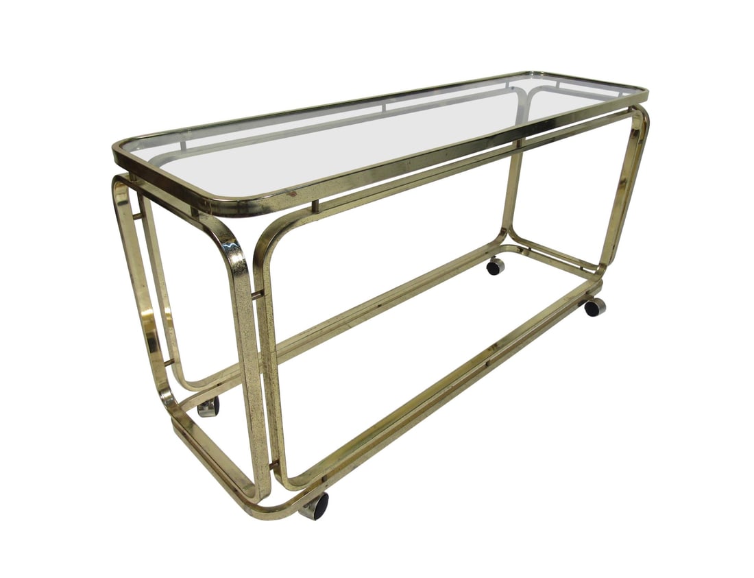 Mid-Century Modern Bar Cart: Long rolling cart in polished brass with two shelves. Used as a bar cart or rolling console table. // PICK UP LOCATION: WALL NJ // Condition: Good. Wear consistent with age and use. Minor fading. Oxid