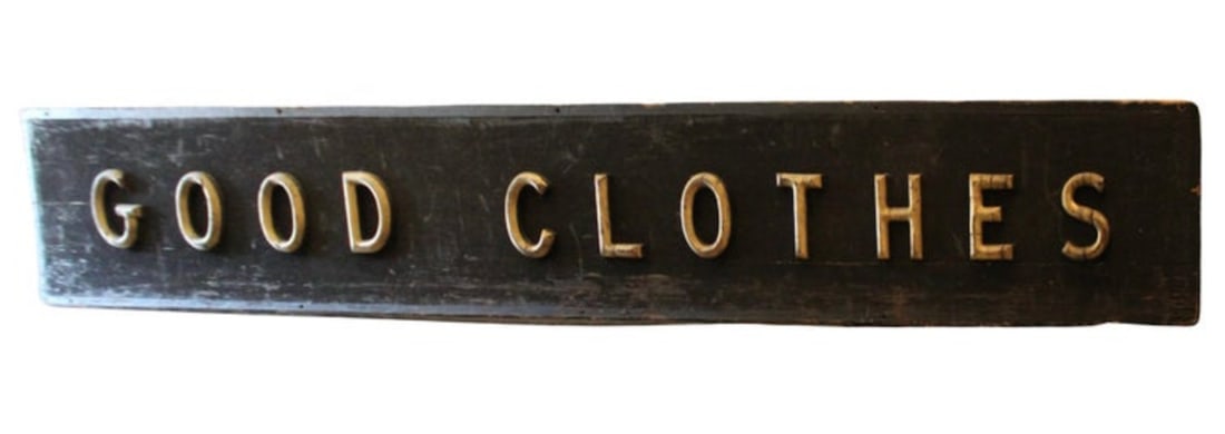 Rustic 12 Foot Clothing Store Sign: This antique clothing store sign made of gold painted wood lettering set on black painted wood back. The massive length of 12 feet and gold over black lettering make for an outstanding piece of advert