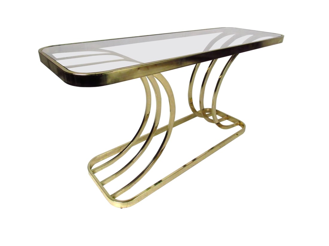 Modern Brass Console Table: A contemporary modern glass top console table featuring a sculpted brass finish base, a unique table for entryway, hall, or sofa. // PICKUP LOCATION: BROOKLYN, NY // Condition: Good. Wear