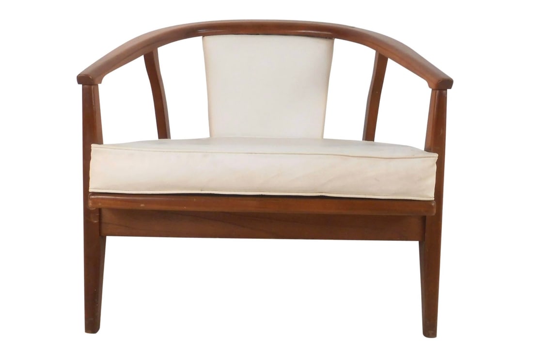 Unique Mid-Century Modern Barrel Back Side Chair: This beautiful vintage modern lounge chair features a unique barrel backrest that slants downward. This captain chair style piece has angled back legs and thick padded seating covered in white vinyl.