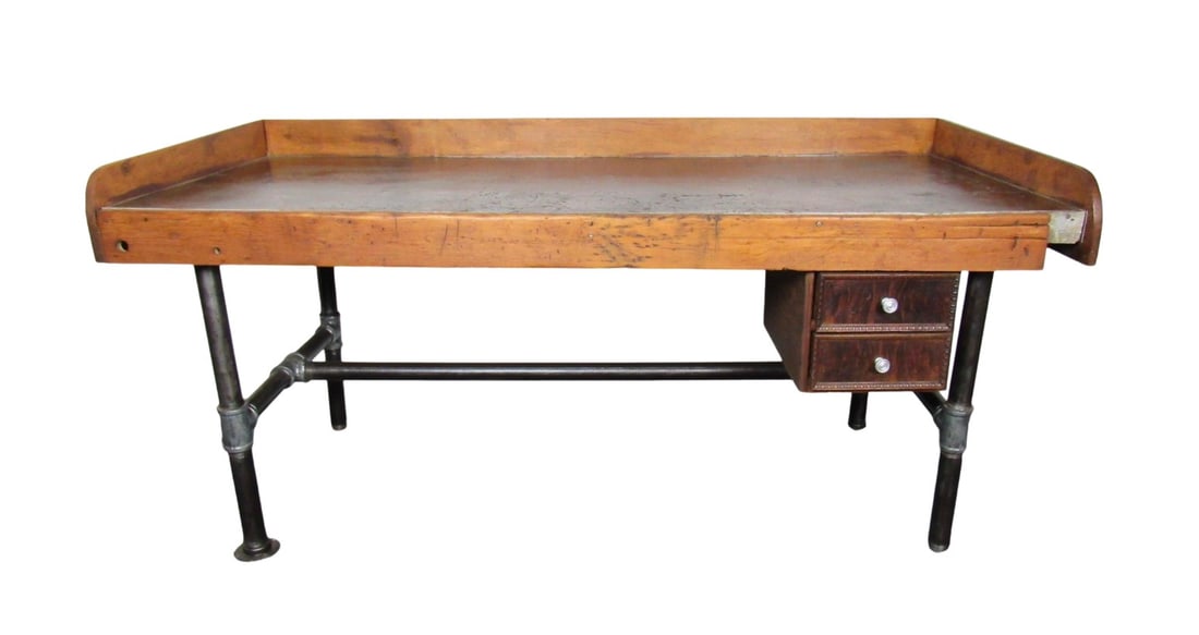 Large Industrial Work Desk: This large and sturdy work table is full of weathered charm and Mid-Century details. Raised edges keep items from falling or rolling off the surface, and additional drawers add functionality. // 