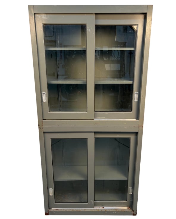 Industrial Stackable Metal Cabinet With Sliding Glass Doors: A striking mid-century industrial metal cabinet featuring a smooth sliding glass door and a clean, utilitarian silhouette. Combines rugged construction with refined display functionality, making it id