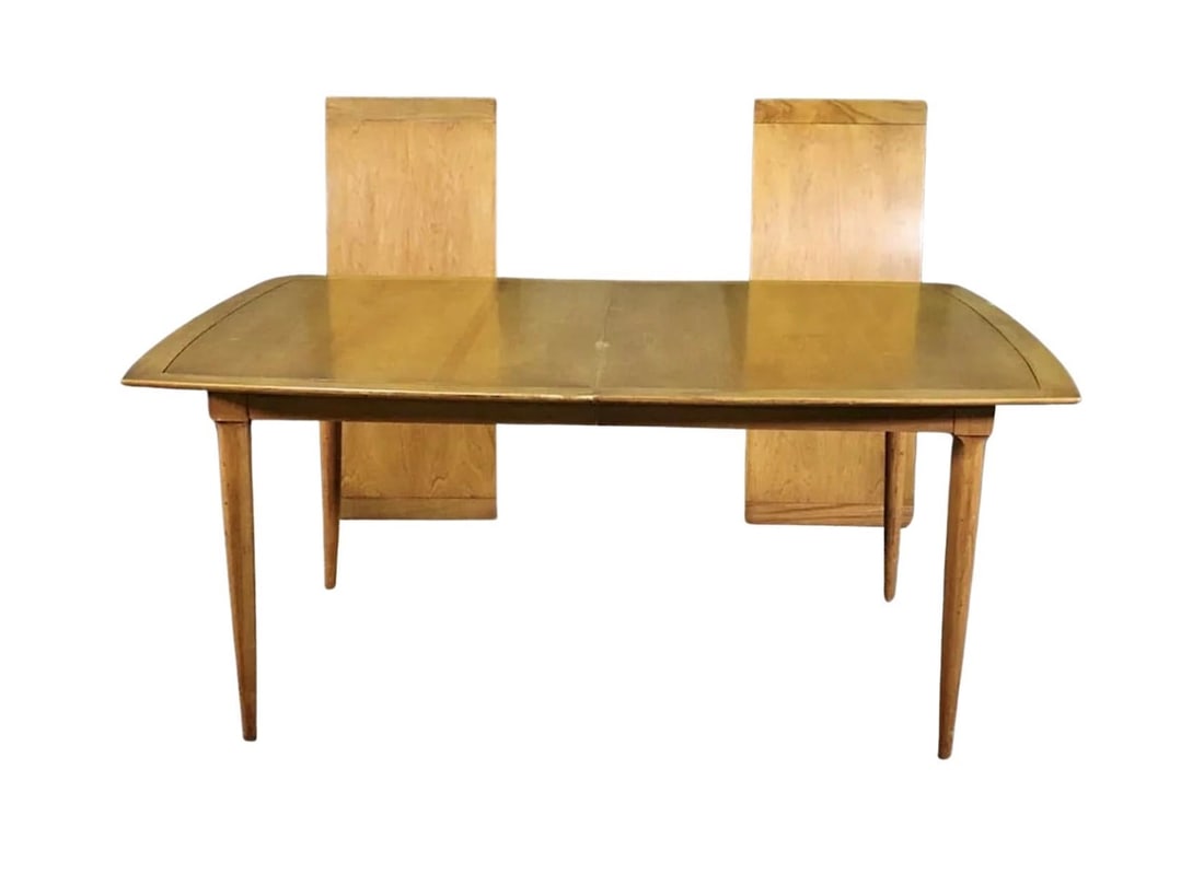 Mid-Century Dining Table by Tomlinson: Vintage dining table by Tomlinson for their 'Sophisticate' series. Walnut grain throughout with a lighter border and tapered legs. Table has two 18" leaves to open from 66" to 8 1/2 feet long. // PICK