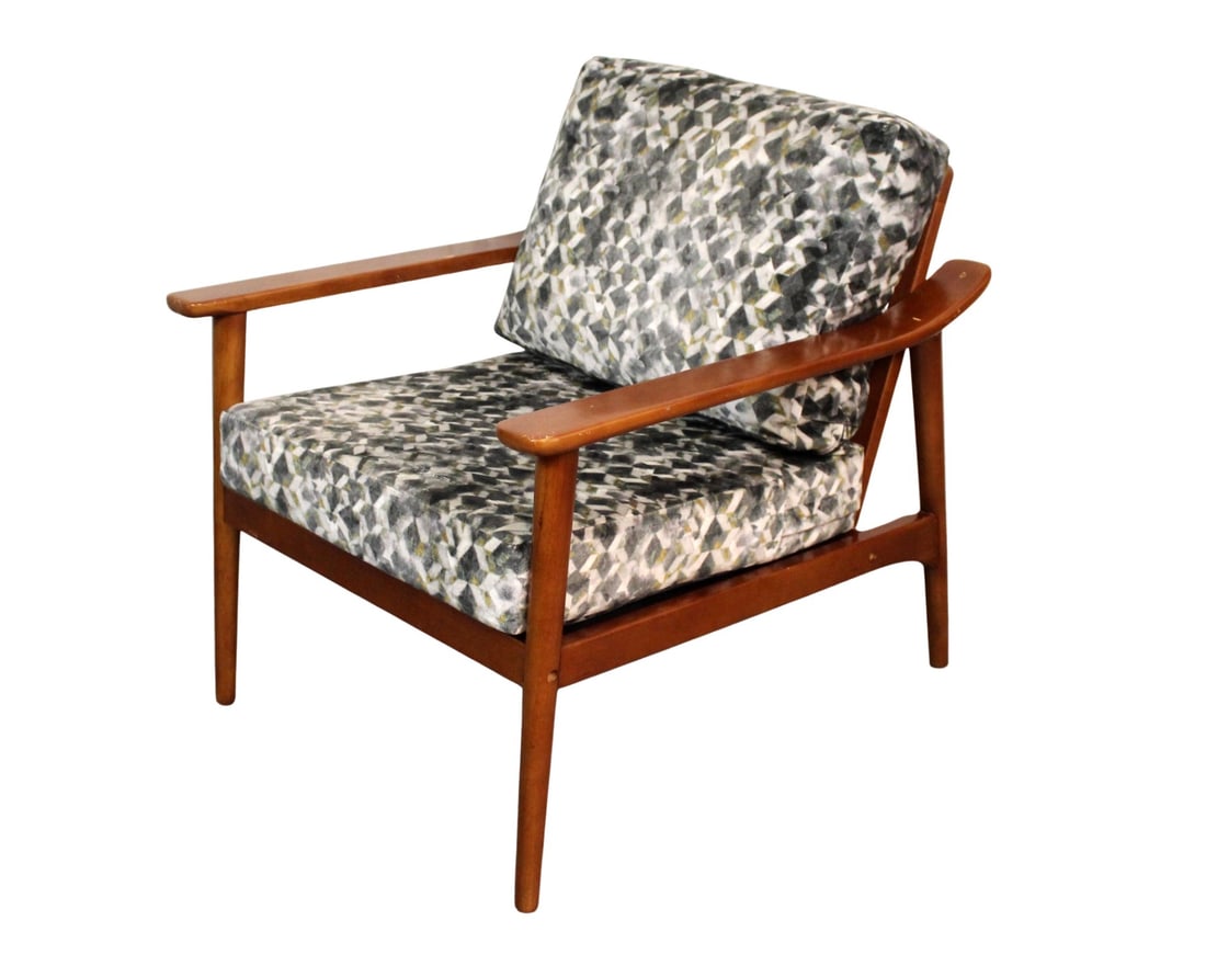 Scandinavian Lounge Chair by Jonathan Adler: Blending modern glamour with Nordic simplicity, this Scandinavian-style lounge chair by Jonathan Adler features clean lines, tapered legs, and plush upholstery. A fresh take on mid-century design, it