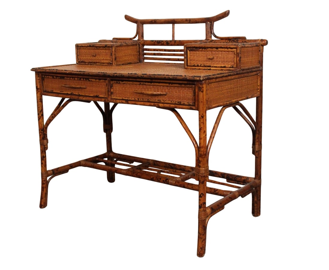 Vintage British Colonial Faux Bamboo & Grasscloth Desk: A stylish 20th century British Colonial style writing desk featuring a faux bamboo wood frame with rich tortoiseshell finish and woven grasscloth panels. The upper gallery includes four petite