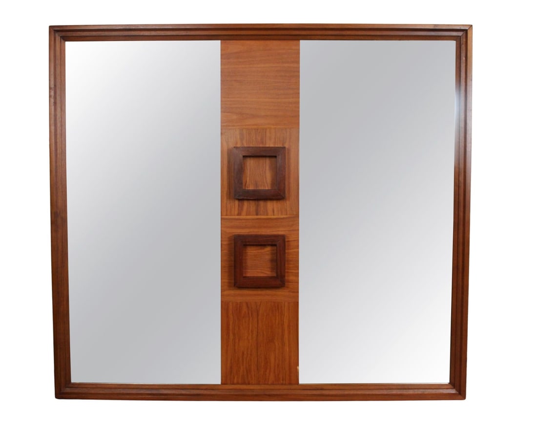 Unique Three Dimensional Mirror: Striking Mid-Century Modern wall mirror featuring Brutalist design elements. The piece is framed in rich walnut with a distinctive center panel showcasing bold, sculptural square reliefs. Flanked by m