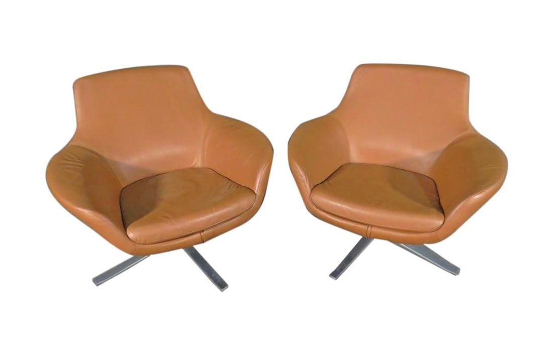 Pair of Leather Swivel Chairs by Coalesse: Pair of swivel chairs combining rich leather with a sleek and comfortable design, by Coalesse. This pair of chairs is perfect for an office or business setting. // PICKUP LOCATION: WALL, NJ // Conditi