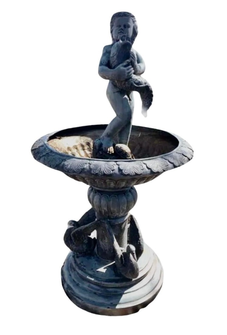 Bronze Fountain w/ Boy: Five foot tall fountain made of bronze, featuring a large bowl and cherub boy holding a fish. The fish spouts the water into the large bowl, egrets surround the base. // PICKUP LOCATION: BROOKLYN, NY