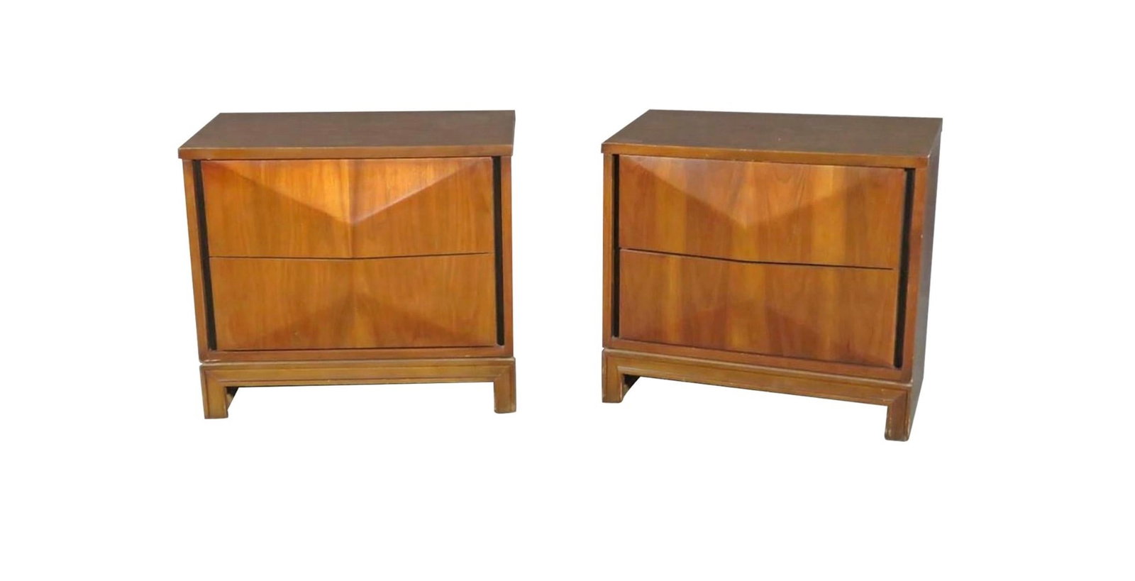 Pair of Diamond Front Night Stands in the Style of Johnson Carper: With an understated, simple design and a rich walnut woodgrain, this pair of diamond front night stands are styled after mid-century furniture maker Johnson Carper. Two dovetailed drawers open to
