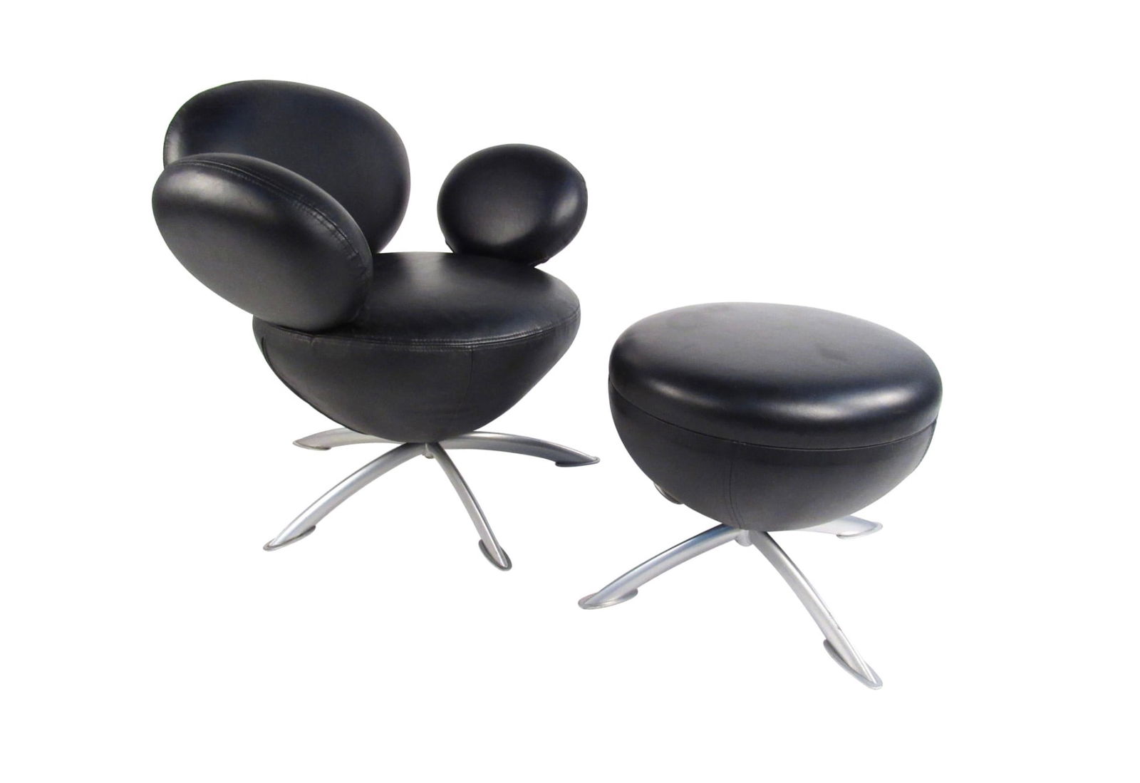 Mid-Century Modern Lounge Chair & Ottoman, Arne Jacobsen Style: This uniquely shaped Mid-Century Modern style lounge chair features upholstered vinyl swivel chair paired with matching ottoman. Uniquely sculpted in a style similar to mid-century master Arne