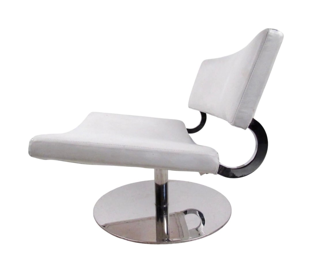 Modern Leather & Chrome Swivel Lounge Chair: This stylish slipper chair features a chrome swivel base and uniquely wide seat. Perfect lounge chair for any modern interior, the mix of leather and chrome makes a wonderful addition to home or
