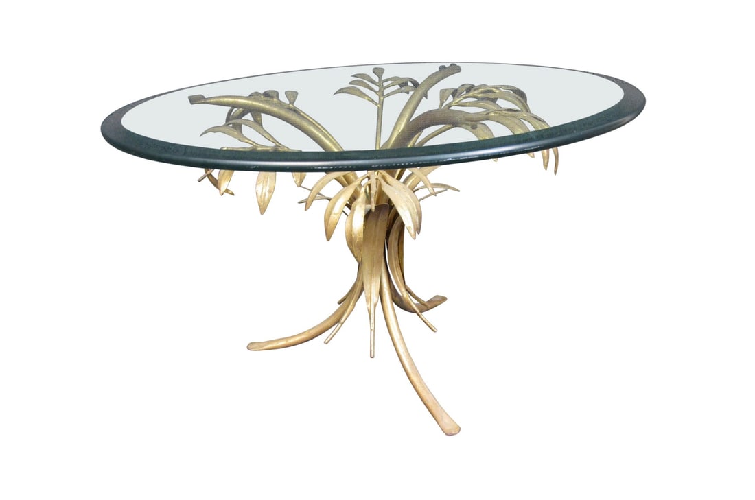 Gold Leaf Palm Tree Side Table: With intricate gold leaf palm tree-themed designs as its stand, this unique side table features a large rounded top of thick glass. // PICKUP LOCATION: WALL, NJ // Condition: Good. Wear