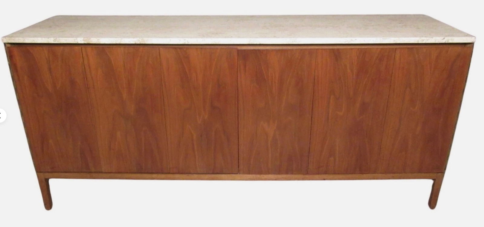 Paul McCobb for Calvin Furniture Eight Drawer Marble Top Dresser: Early Paul McCobb designed "Irwin" Collection dresser made by Calvin Furniture of Grand Rapids, MI. Robust walnut construction conceals eight large pull-out drawers behind a pair of folding doors, whi