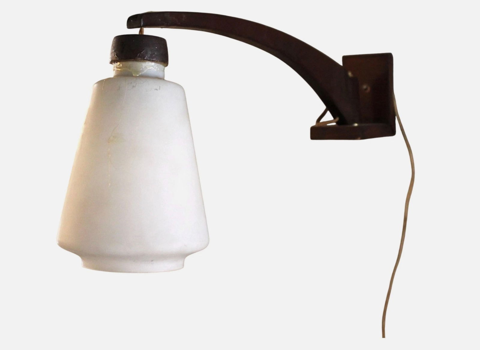 Vintage Scandinavian Plug-In Wall Sconce: A subtle and attractive Scandinavian-styled wall sconce, wired to plug directly into an outlet. A classic piece of vintage lighting that is sure to brighten (and cultivate) any room it finds itself