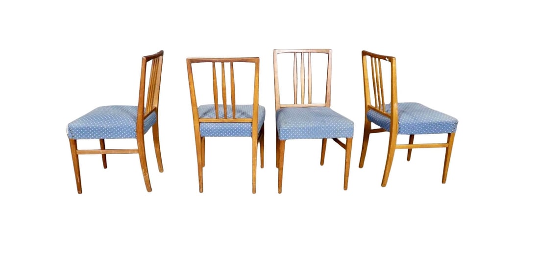 W. H. Russell for Gordon Russell Dining chairs: This set of four dining chairs was made by UK furniture maker Gordon Russell, and designed by W. H. Russell. Spindle back design that flows down to the floor, plus a cushioned seat with nail head
