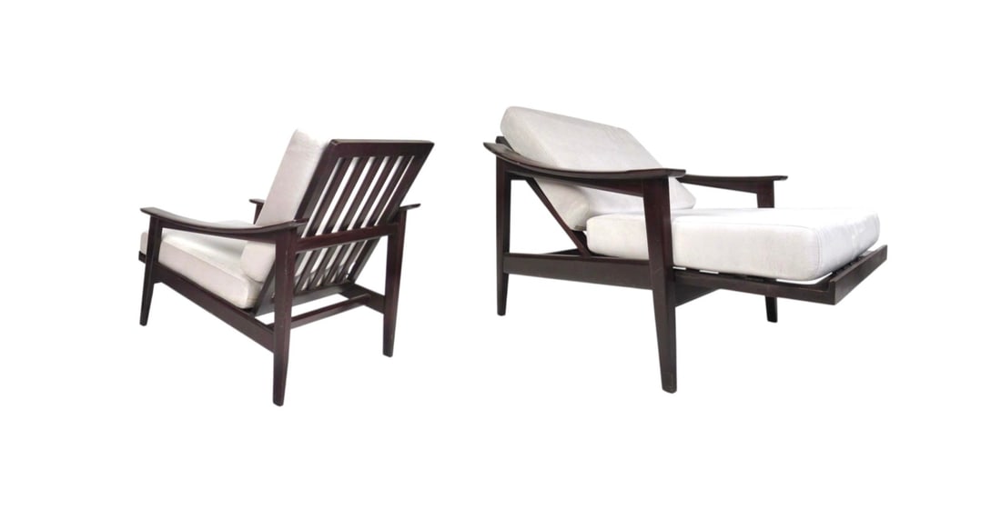 Reclining Mid-Century Armchairs w/ Adjustable Backrest: This stunning Mid-Century Modern armchair has the ability to recline, offering extreme comfort in any seating arrangement. The plush off-white velour upholstery covers two overstuffed removable