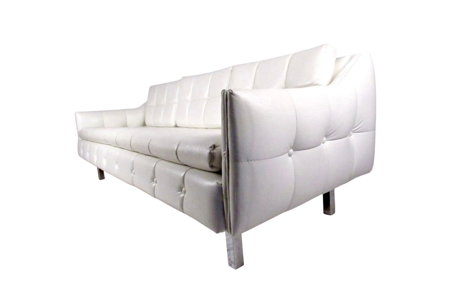 Fully Tufted White Three Seat Sofa: Vintage-modern sofa featuring chrome legs and tufted white vinyl upholstery with removable cushions. Funky retro style includes tufted vinyl and comfortable proportions, a great seating addition to