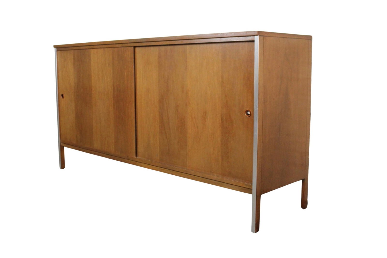 Paul McCobb for Calvin 'Linear' Mid Century Walnut Sideboard: Sliding door credenza by Paul McCobb for his Linear series. Made with walnut and accenting aluminum. Two sliding doors open to accommodate your books or record collection. // PICKUP LOCATION: BROOKLYN