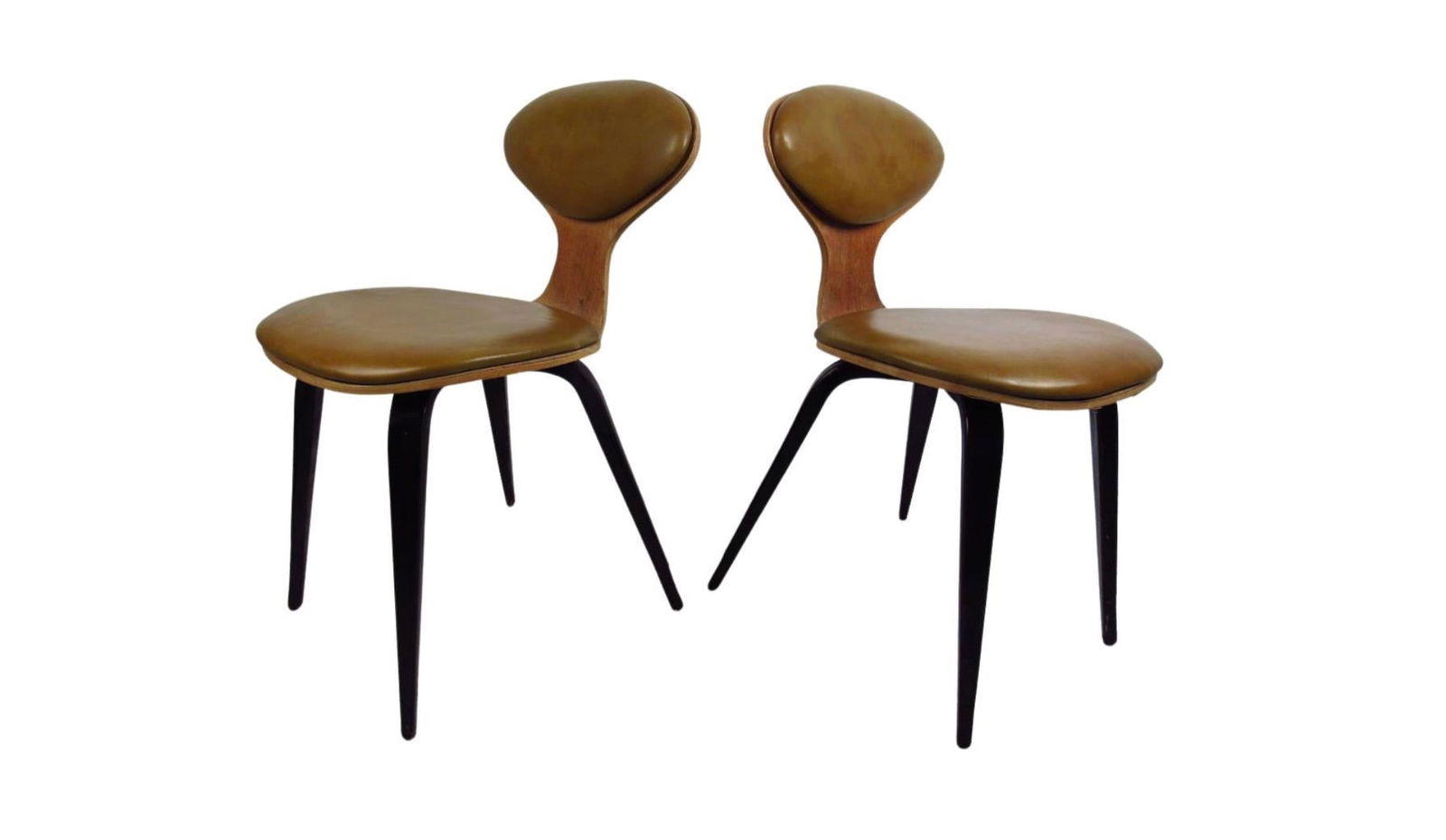 Mid-Century Bentwood Chairs in the Style of Norman Cherner: This pair of mid century chairs in the style of Norman Cherner feature a bentwood design, original vinyl upholstered seat backs, and black painted tapered legs which offer a modern accent to any home