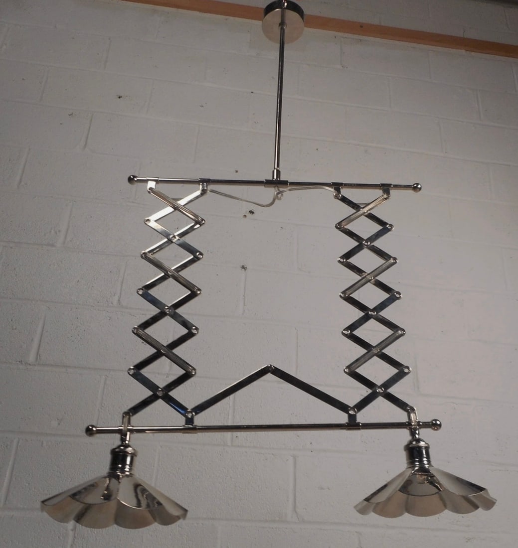 Unique Contemporary Modern Chrome Hanging Lamp: This gorgeous mid-century modern style chandelier is made of chrome and features the ability to extend from 32h all the way to 46h. Stylish design with two sculpted globes on each side and a long