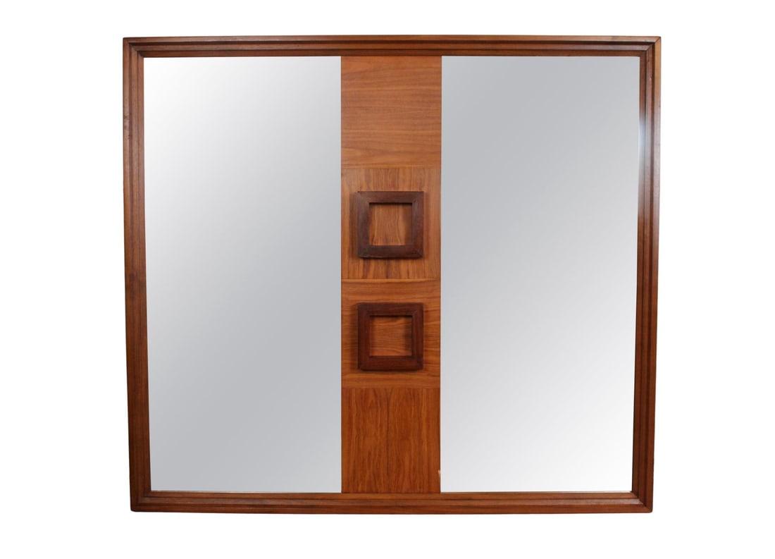 Unique Three Dimensional Mirror: Striking Mid-Century Modern wall mirror featuring Brutalist design elements. The piece is framed in rich walnut with a distinctive center panel showcasing bold, sculptural square reliefs. Flanked by