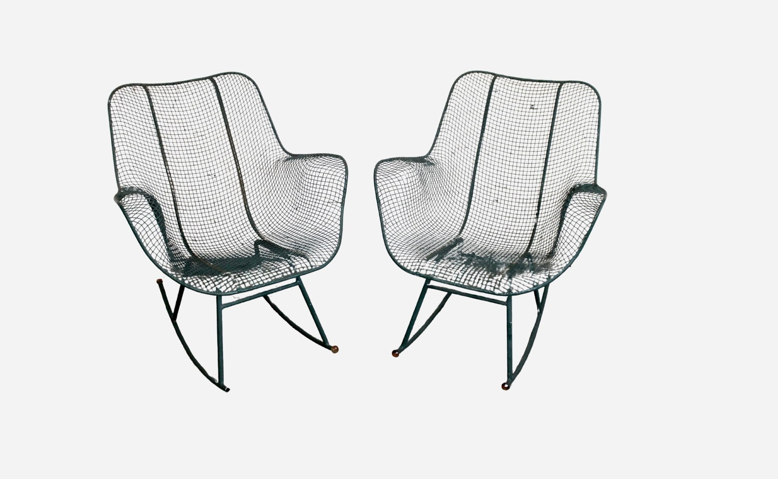Pair of Russell Woodard Rocking Patio Armchairs: Iconic pair of mid-century wrought iron rocking armchairs by Russell Woodard, featuring the signature sculpted mesh design and original green finish. These elegant and durable chairs offer both