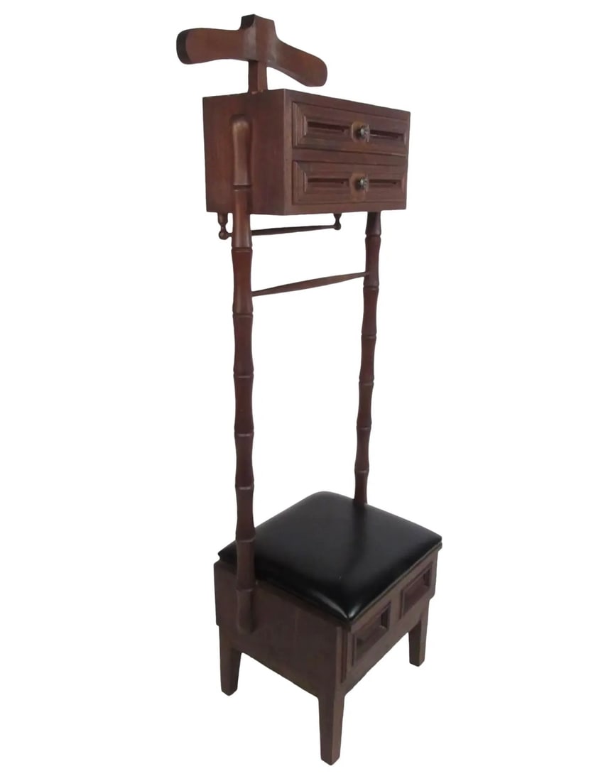 Vintage Walnut and Vinyl Valet Chair: This beautiful vintage valet chair features a thick cushioned seat that opens up to unveil a large storage space. An elegant dark walnut finish, a coat hanger on the top, and dovetailed drawers show