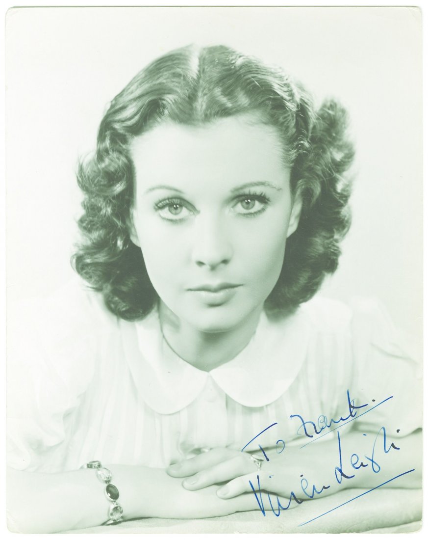 LEIGH, VIVIEN SP A 10x8" head and shoulders black and: LEIGH, VIVIEN SP A 10x8" head and shoulders black and white photo of Vivien Leigh, inscribed and signed in blue ink "To Frank, Vivien Leigh". Some minor creasing and edge wear, particularly at corners