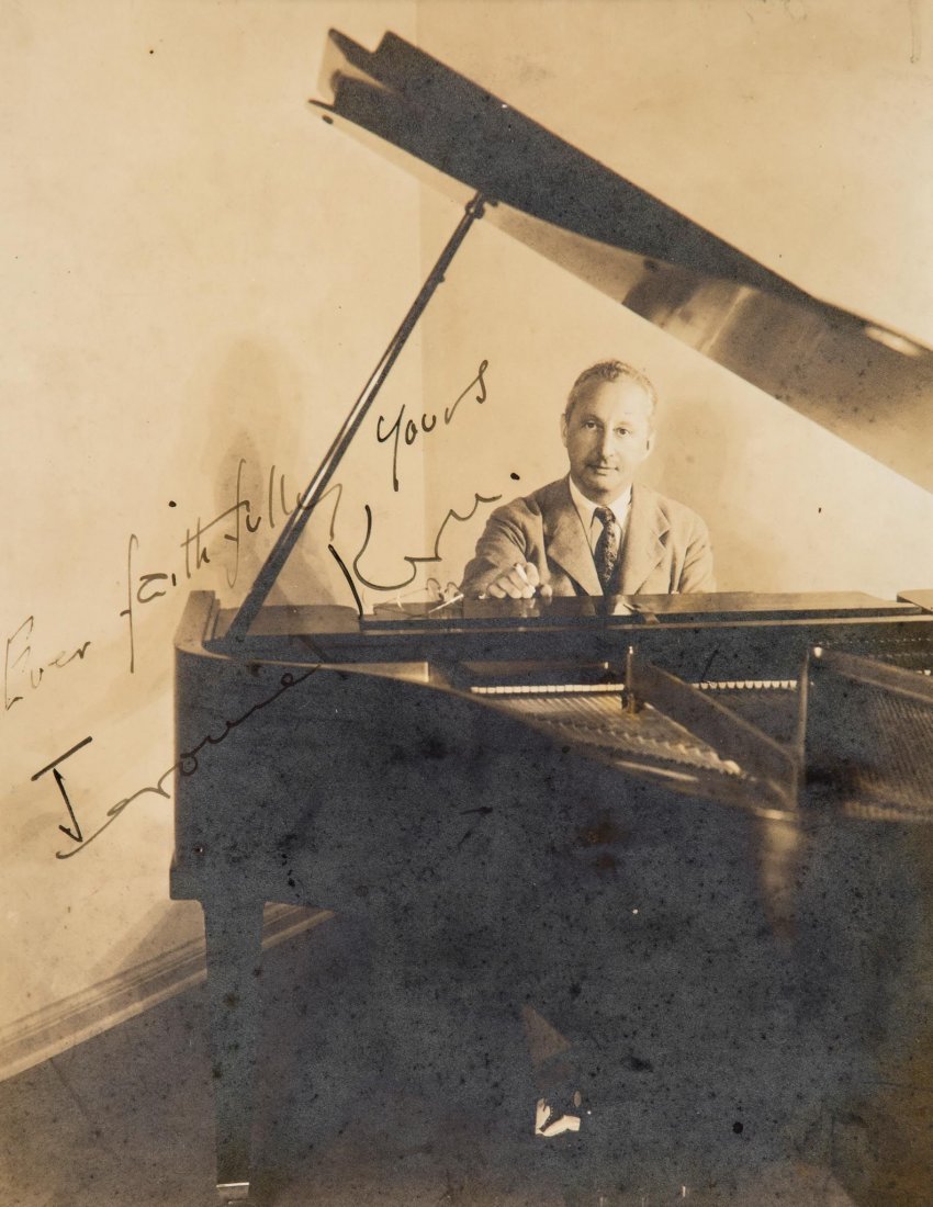 SP A rare and elegant 23.3 x 18.7cm, sepia toned: SP A rare and elegant 23.3 x 18.7cm, sepia toned photograph of Jerome Kern seated at the piano, signed in black ink "Ever faithfully yours, Jerome Kern". Some silvering. A charming portrait of the fam