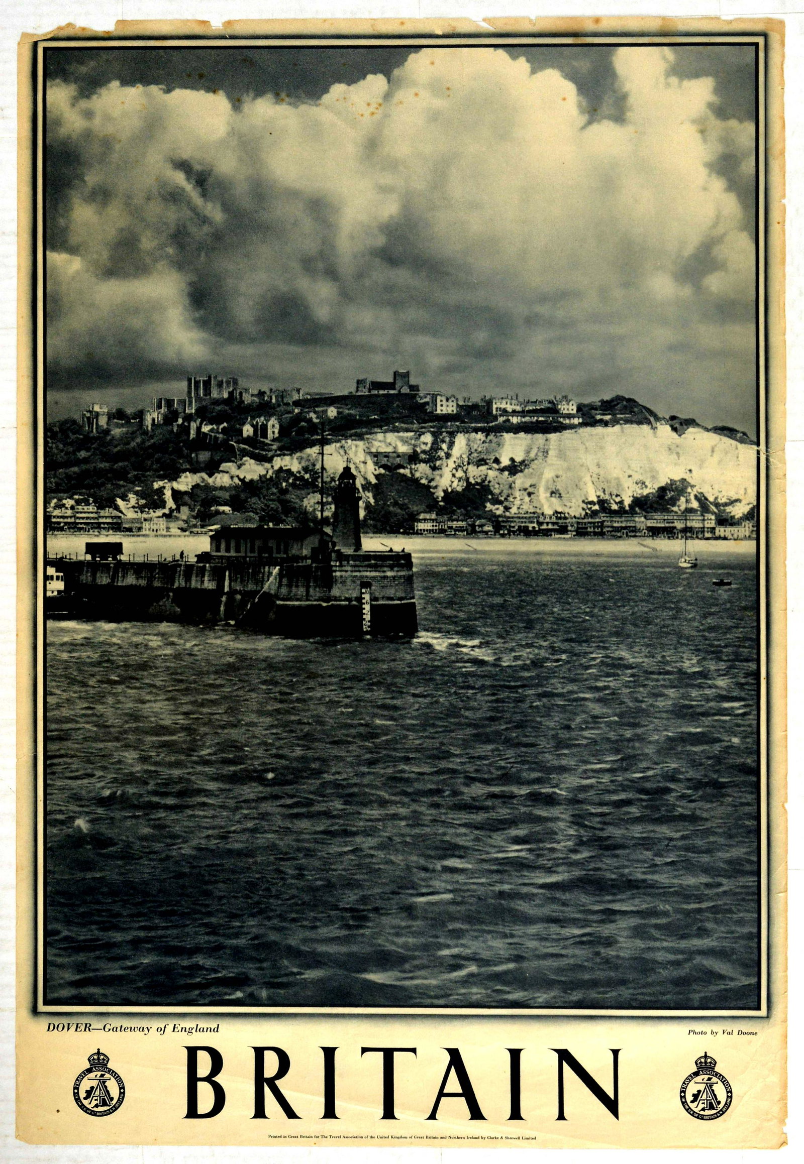 Travel Poster Britain Dover Gateway of England: Original vintage travel poster for Britain featuring a black and white photo by Val Doone titled Dover - Gateway of England featuring a boat sailing past the town and the iconic white cliffs. Printed 