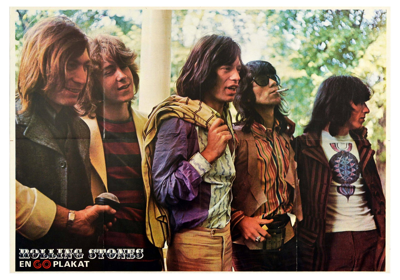Advertising Poster Rolling Stones GO Magazine Jagger: Original vintage poster of the Rolling Stones issued by GO magazine. The photograph shows the Rolling Stones smiling, standing in a line with trees in the background. The poster is double sided with a
