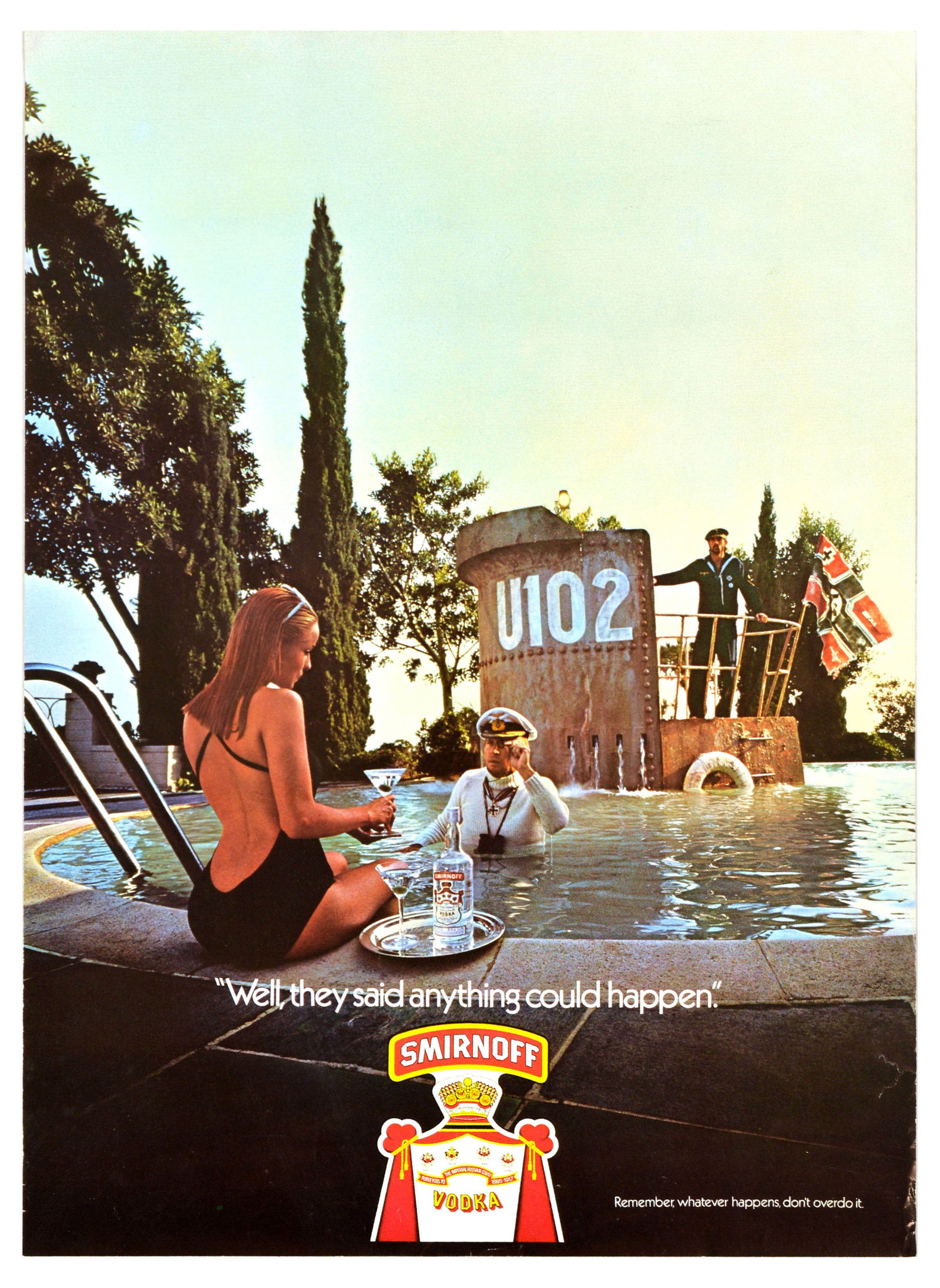 Advertising Poster Smirnoff Vodka Submarine Brian Duffy Alcohol: Original vintage drink advertising poster for Smirnoff, the renowned vodka brand founded in Moscow, featuring a photograph of a lady sitting on the edge of the swimming pool with a cocktail glass in h