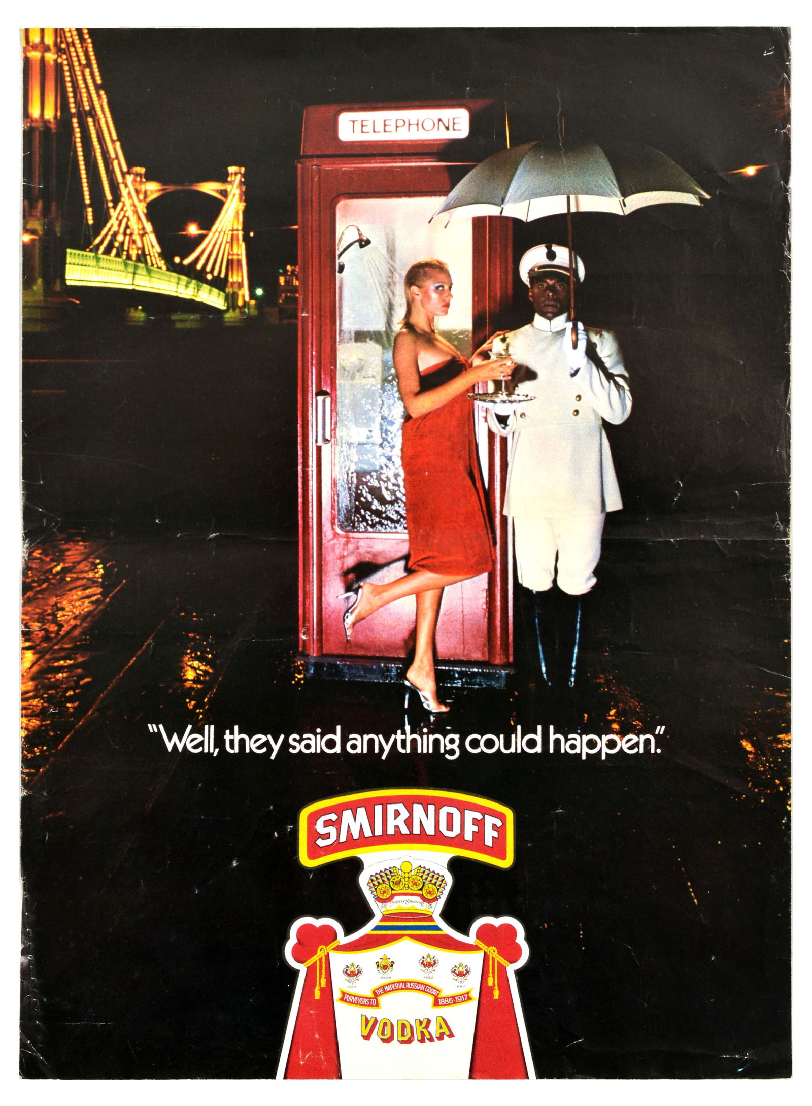 Advertising Poster Smirnoff Vodka Brian Duffy Phone Box Albert Bridge: Original vintage drink advertising poster for Smirnoff, the renowned vodka brand founded in Moscow. Smirnoff uses a humorous advertising slogan - "Well, they said anything could happen" The photograph