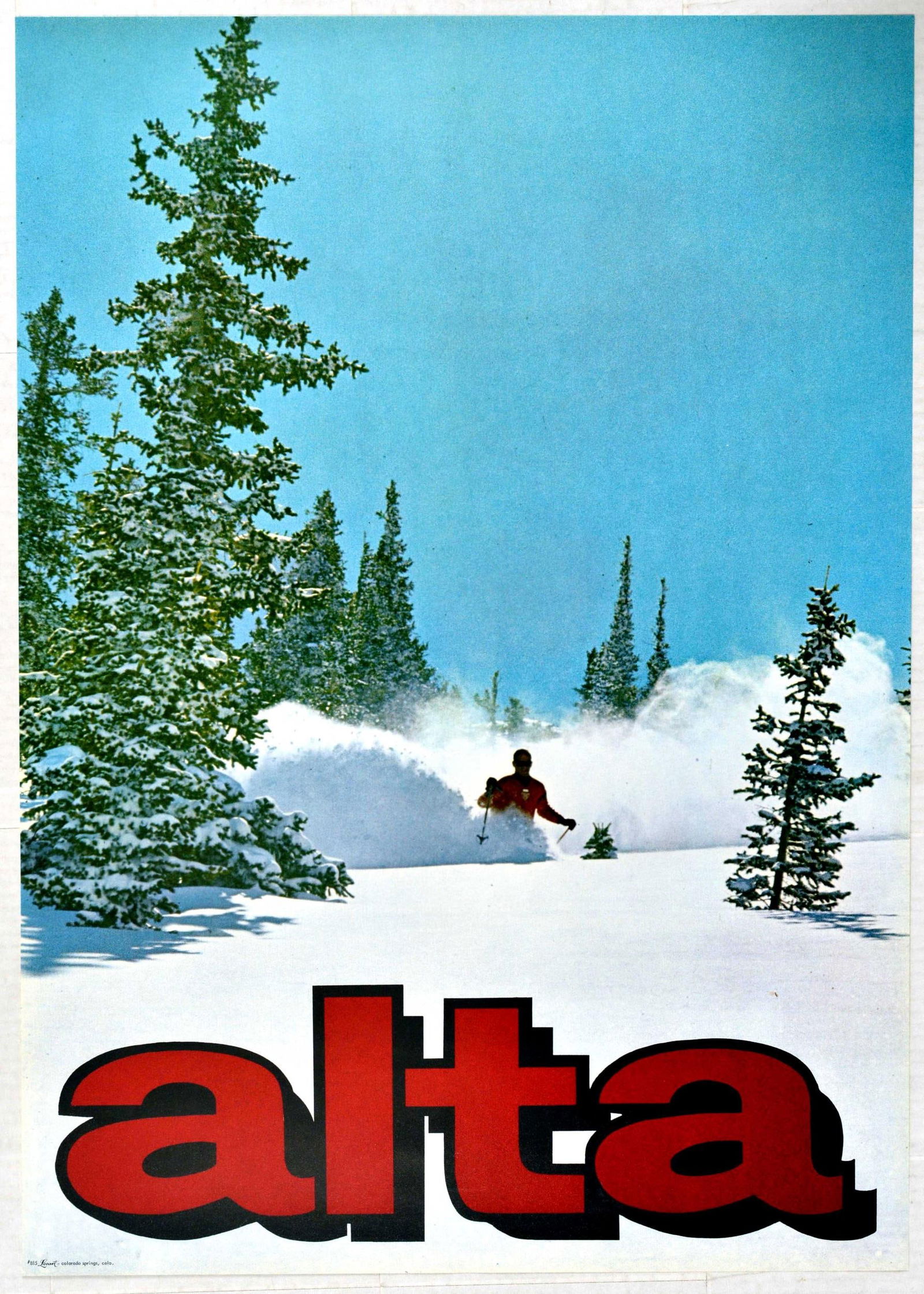 Sport Poster Alta Ski Utah USA: Original vintage ski travel poster advertising Alta Ski resort featuring a great image of a man in an orange ski suit skiing down a snowy mountain side between trees. Bold stylised red lettering below