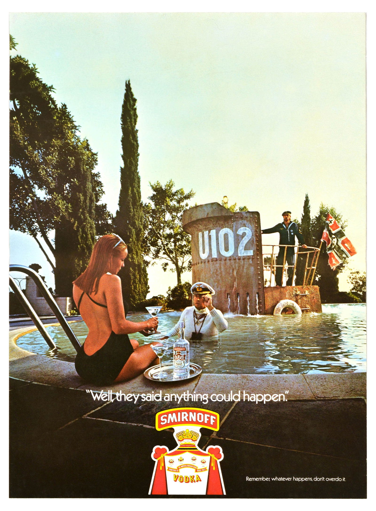 Advertising Poster Smirnoff Vodka Submarine Brian Duffy Alcohol: Original vintage drink advertising poster for Smirnoff, the renowned vodka brand founded in Moscow, featuring a photograph of a lady sitting on the edge of the swimming pool with a cocktail glass in h