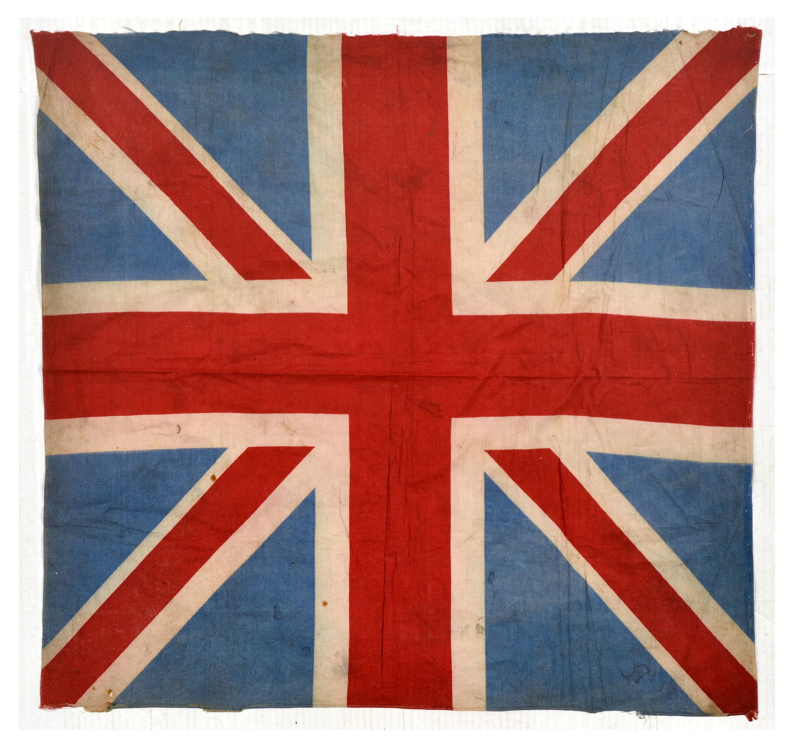 War Union Jack Flag WWII United Kingdom: Original vintage cotton Second World War era Union Jack or Union Flag, the national flag of the United Kingdom. Fair condition, creasing, staining, frayed edges. Country of issue: UK, designer: Unknow