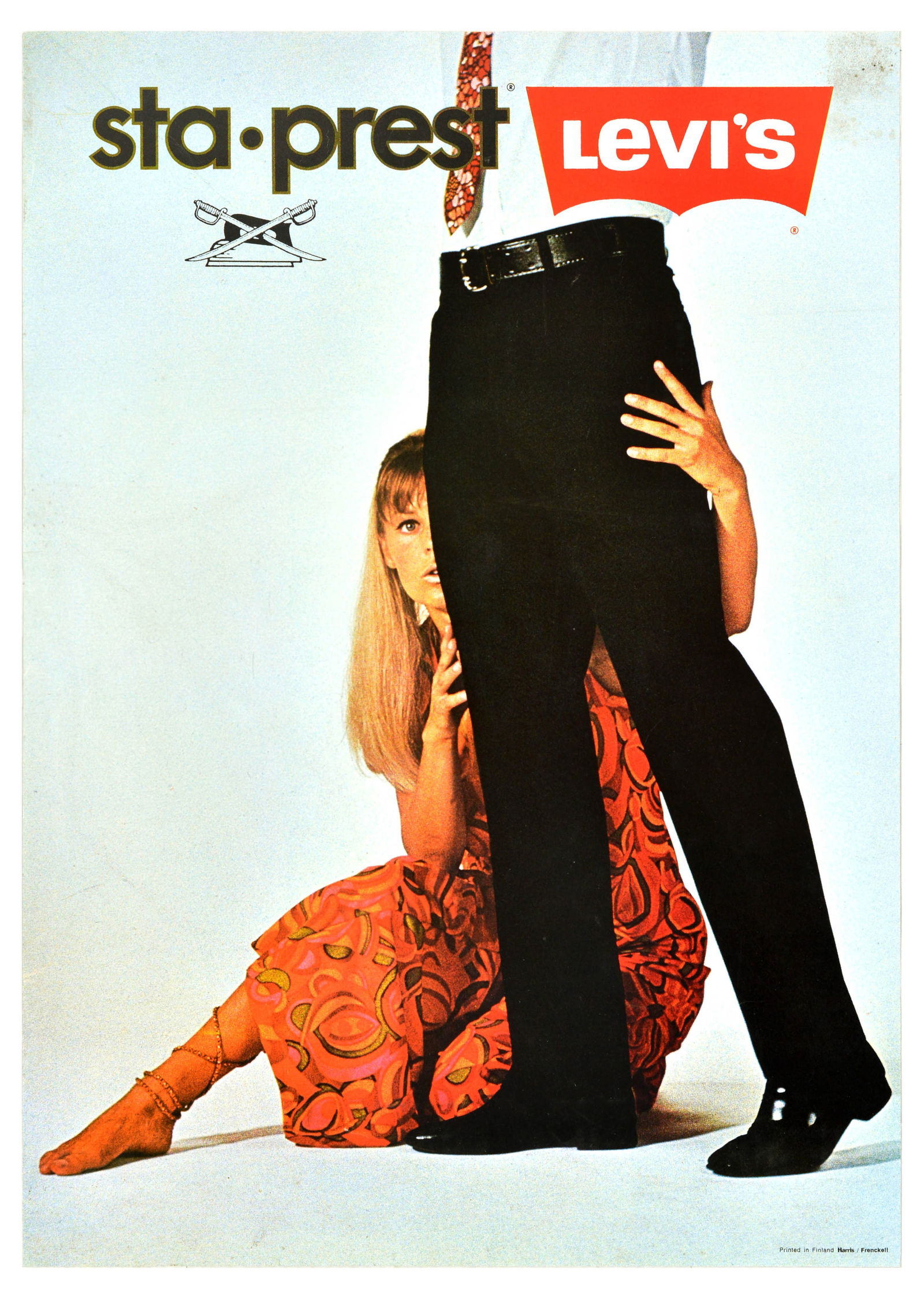 Advertising Poster Sta Prest Levi Strauss Levis Denim Jeans Fashion: Original vintage fashion clothing advertising poster for Sta-Prest by Levi's Denim Jeans, featuring a photograph of a lady in a colourful dress hugging the legs of a man in black jeans. The American c