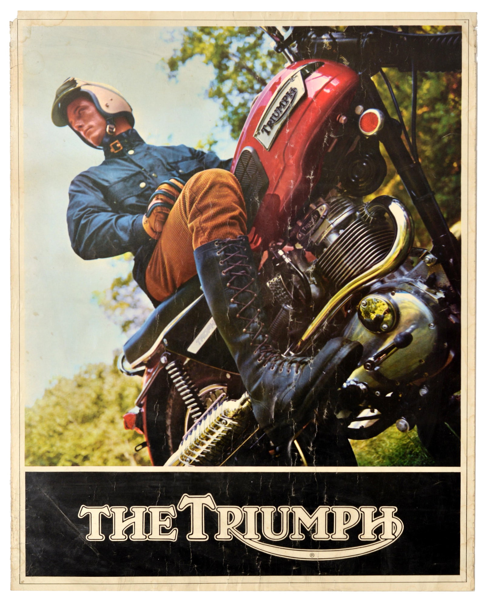 Advertising Poster The Triumph British Motorcycle Automotive: Original vintage British motoring advertising poster for Triumph Motorcycles, featuring a rider in traditional "scrambler" attire, including a Barbour-style waxed cotton jacket, leather gloves, and ta