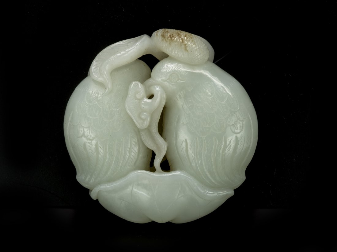 Chinese Jade Carving: Two quails stand under the lotus leaf with Lingchi in its beck, diam. 2 1/4 in.